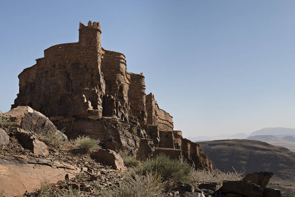 Private luxury travel experience in a remote, off-the-beaten-path location in Morocco, unknown to tourists, surrounded by untouched natural landscapes.