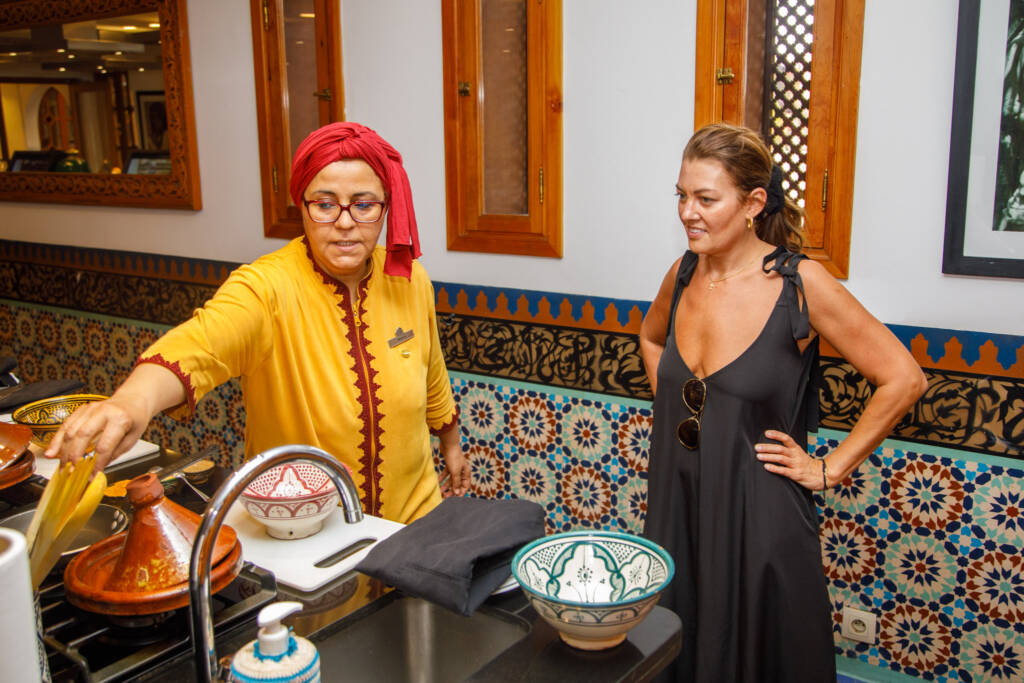 Private chef preparing a luxury Moroccan culinary experience inside a traditional riad in Marrakech