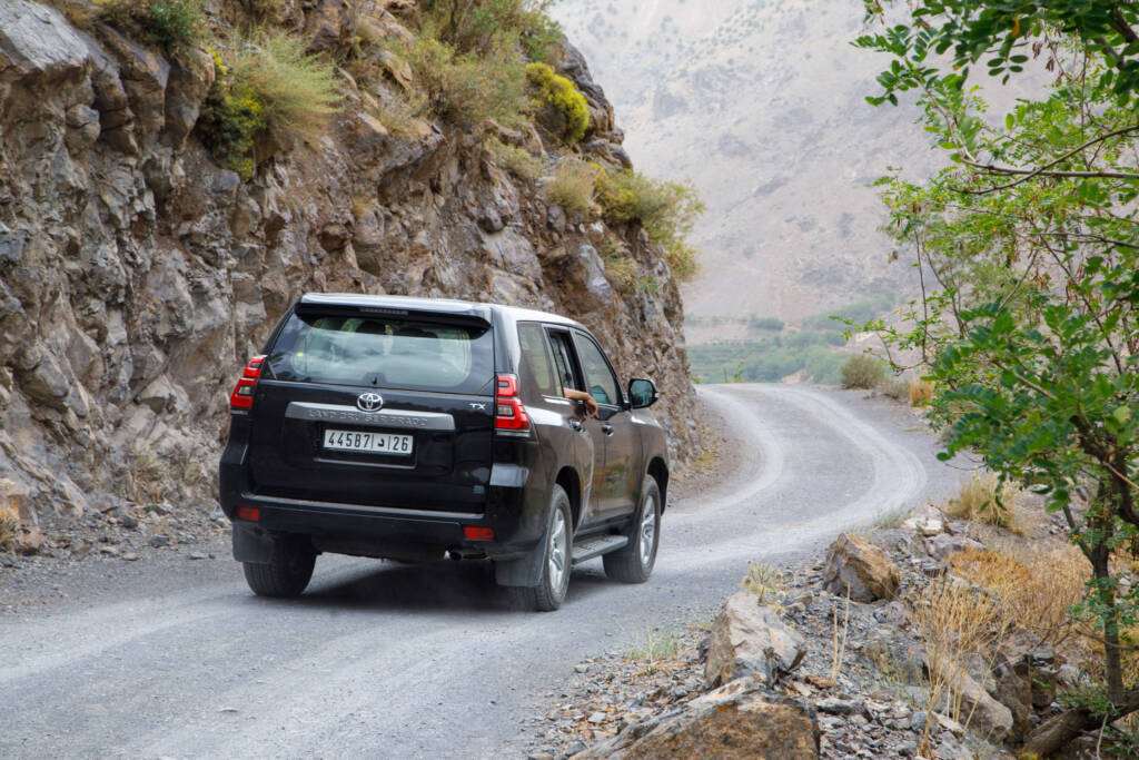 Toyota Prado 4x4 navigating the scenic Atlas Mountains – Morocco Luxury Highlights private chauffeur service