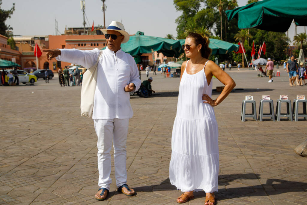 Private luxury guide showing a client the medina of Marrakech, offering expert insights and personalized experiences with Morocco Luxury Highlights