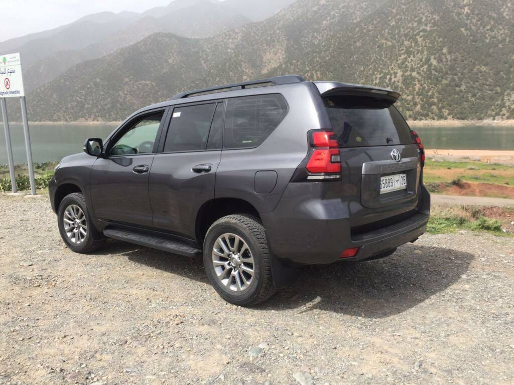 Toyota Prado 4x4 navigating the scenic Atlas Mountains – desert Morocco Luxury Highlights private chauffeur service