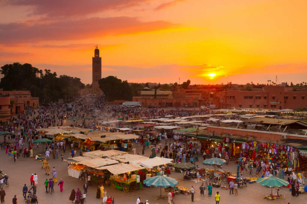 Sunset view over Marrakech medina, highlighting vibrant souks, historic Moroccan streets, and rich cultural atmosphere – luxury travel experience
