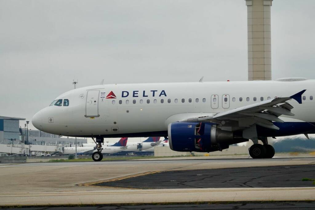 Delta Air Lines aircraft at Marrakech airport, a key connection for your ultimate guide to a luxury Morocco escape for American travelers.
