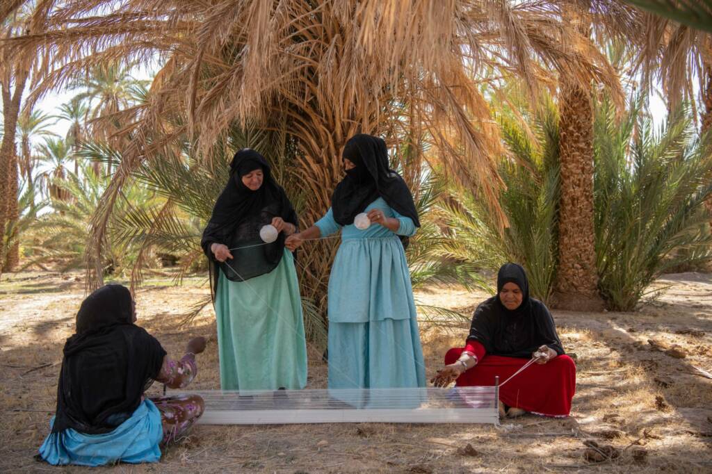 Women’s rug weaving cooperative in Morocco handcrafting traditional Berber carpets