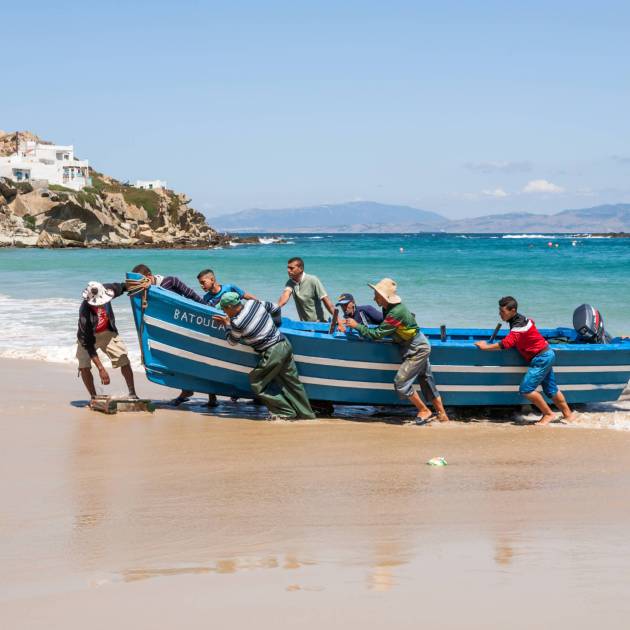 Taghazout beach with boats – luxury Morocco travel, deluxe seaside tours, bespoke Morocco experiences